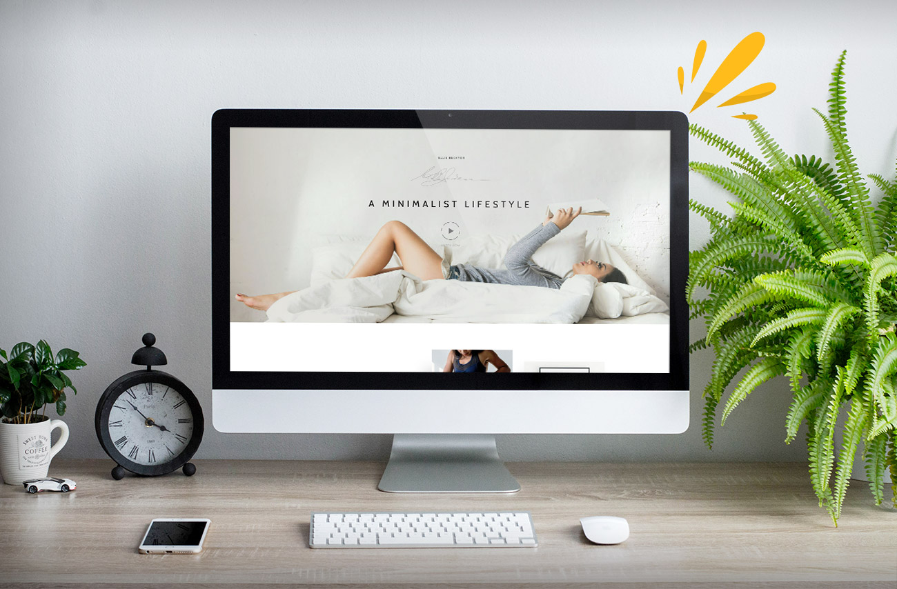 A sleek desktop displays a lifestyle blog featuring a woman relaxing on a bed, surrounded by lush greenery and a vintage clock.